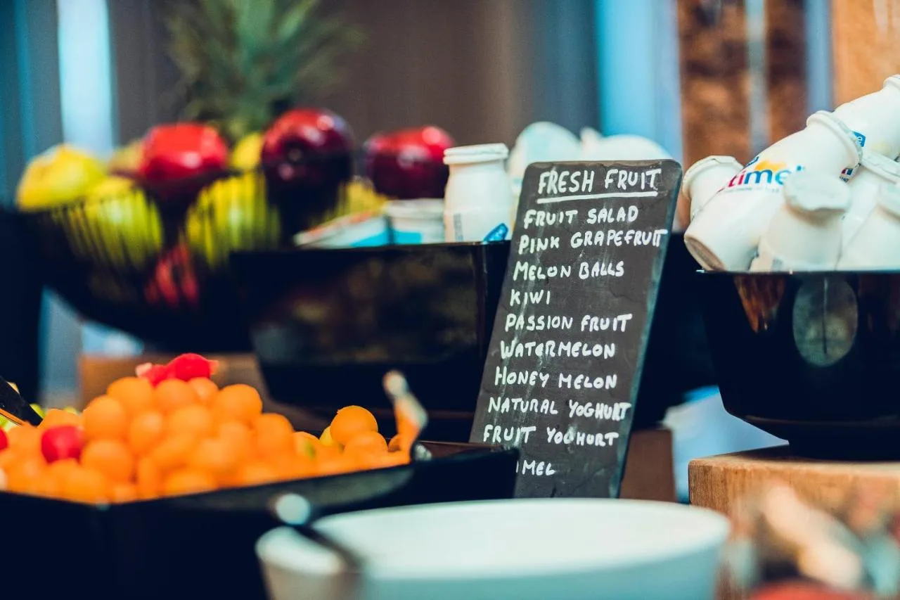 A table of fresh oranges and fruit at the breakfast buffet, The Grand, York